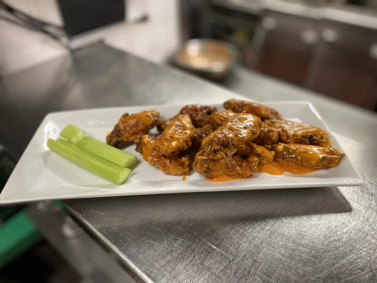 A platter of wings tossed in sauce