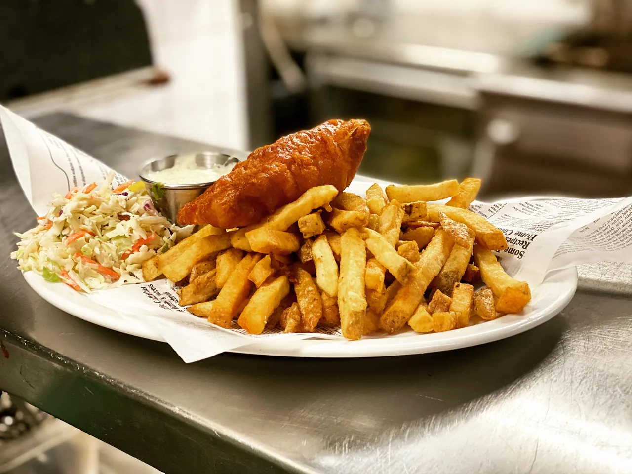 Battered cod with fries, coleslaw and lemon
