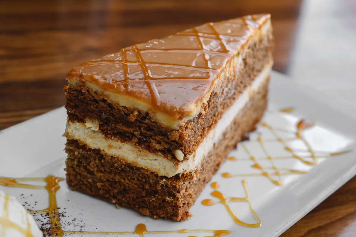 A slice of layered carrot cake