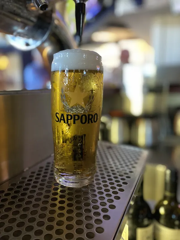 A Sapporo pint at the taps