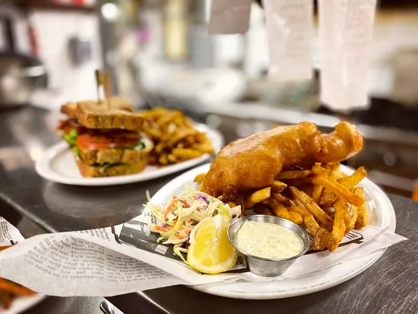Sandwich and battered cod plated together