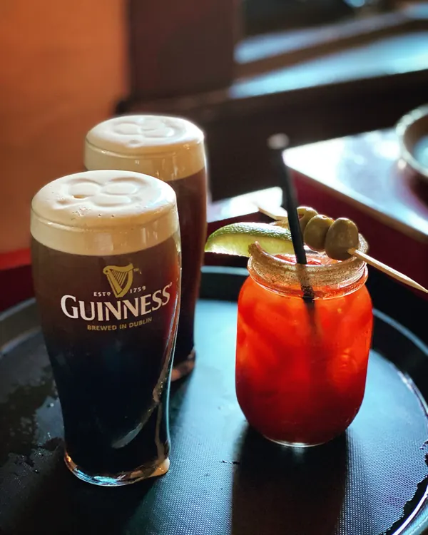 A Guinness and a Caesar on the table