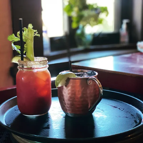 Caesars served in a mason jar and a copper mug