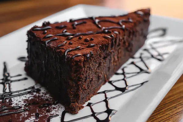 A wedge of dark chocolate torte