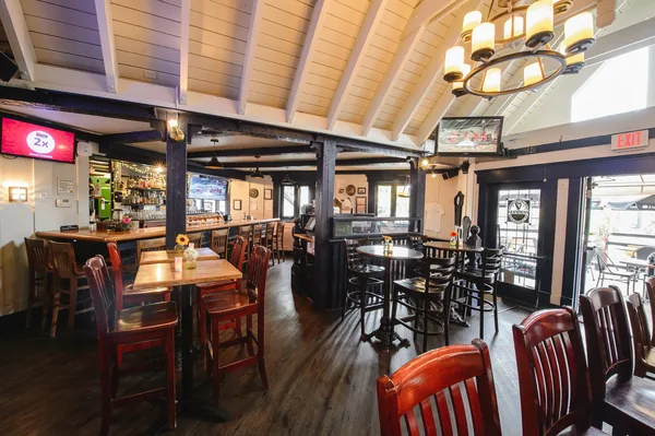 Looking across the main room to the bar, with the deck doors open on the right