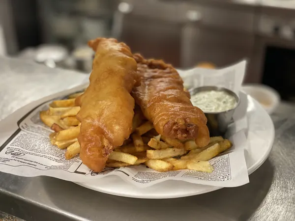 Battered cod and fries with tartar sauce, fresh off the pass