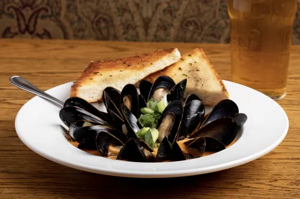 Salt Spring Island mussels in broth with grilled focaccia and a pint