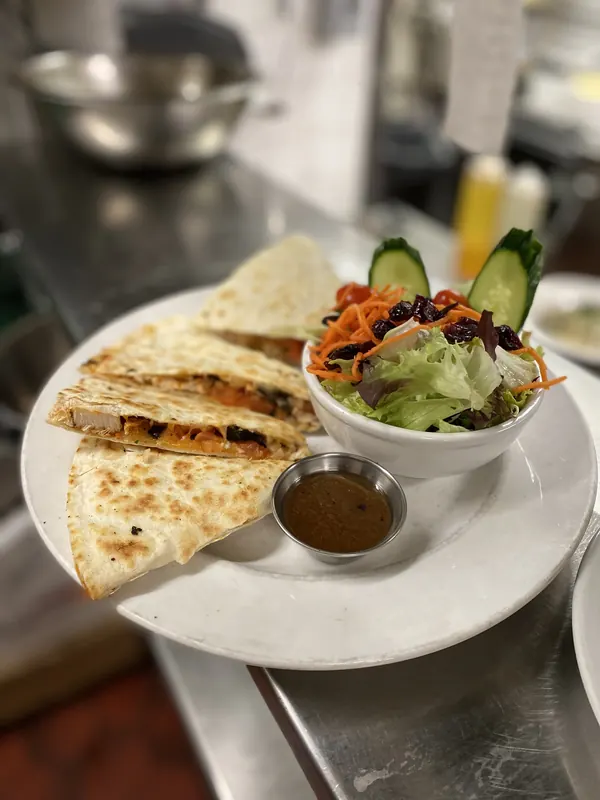 Quesadilla with salad and dipping sauce